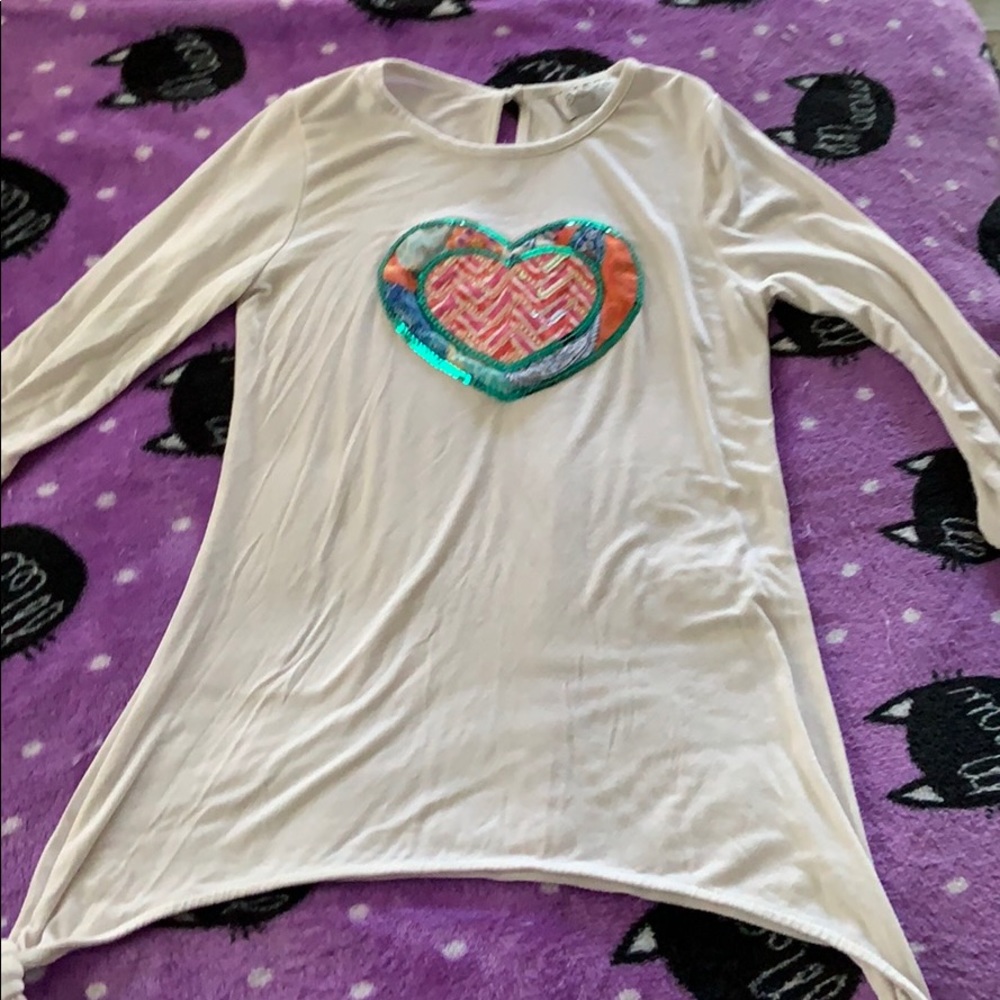 White long sleeve shirt with a sequence heart.